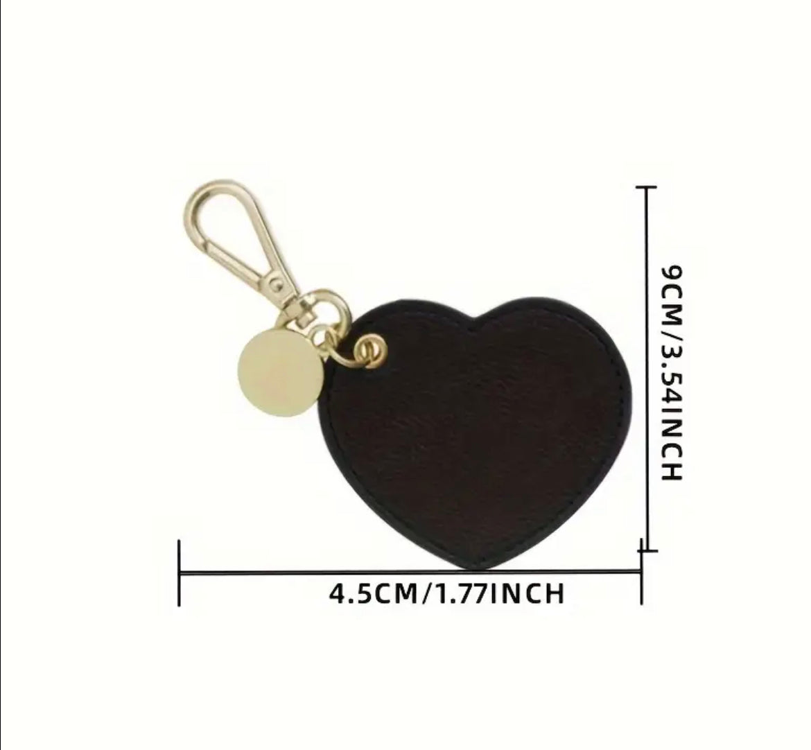 Black heart keychain personalized with hot stamped gold letters in all capital letters. Keychain measures 4.5cm in width and 9cm in length