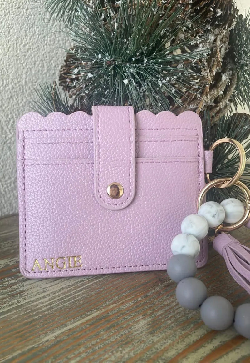 Gold hot stamped wristlet wallet with personalization in all caps letters designed for every day use