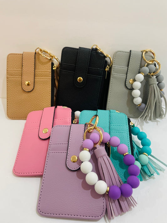 Compact and fashionable womens wallet with silicone beaded wristlet customizable with gold hot stamping in all caps
