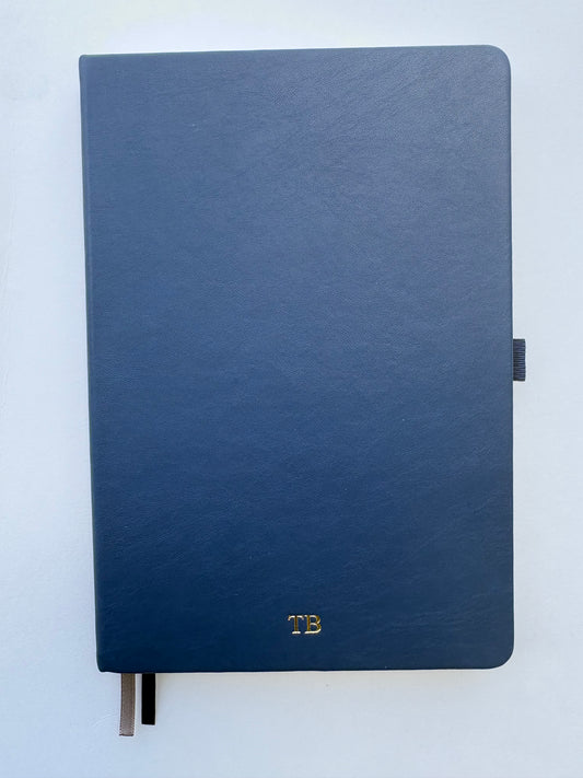 Personalized navy blue leather journal with gold foil monogram on hardcover A5 notebook