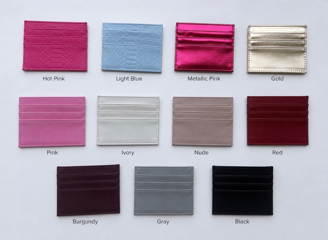 Cardholders displayed in 11 different colors: hot pink, light blue, metallic pink, gold, pink, ivory, nude, red, burgundy,gray, and black
