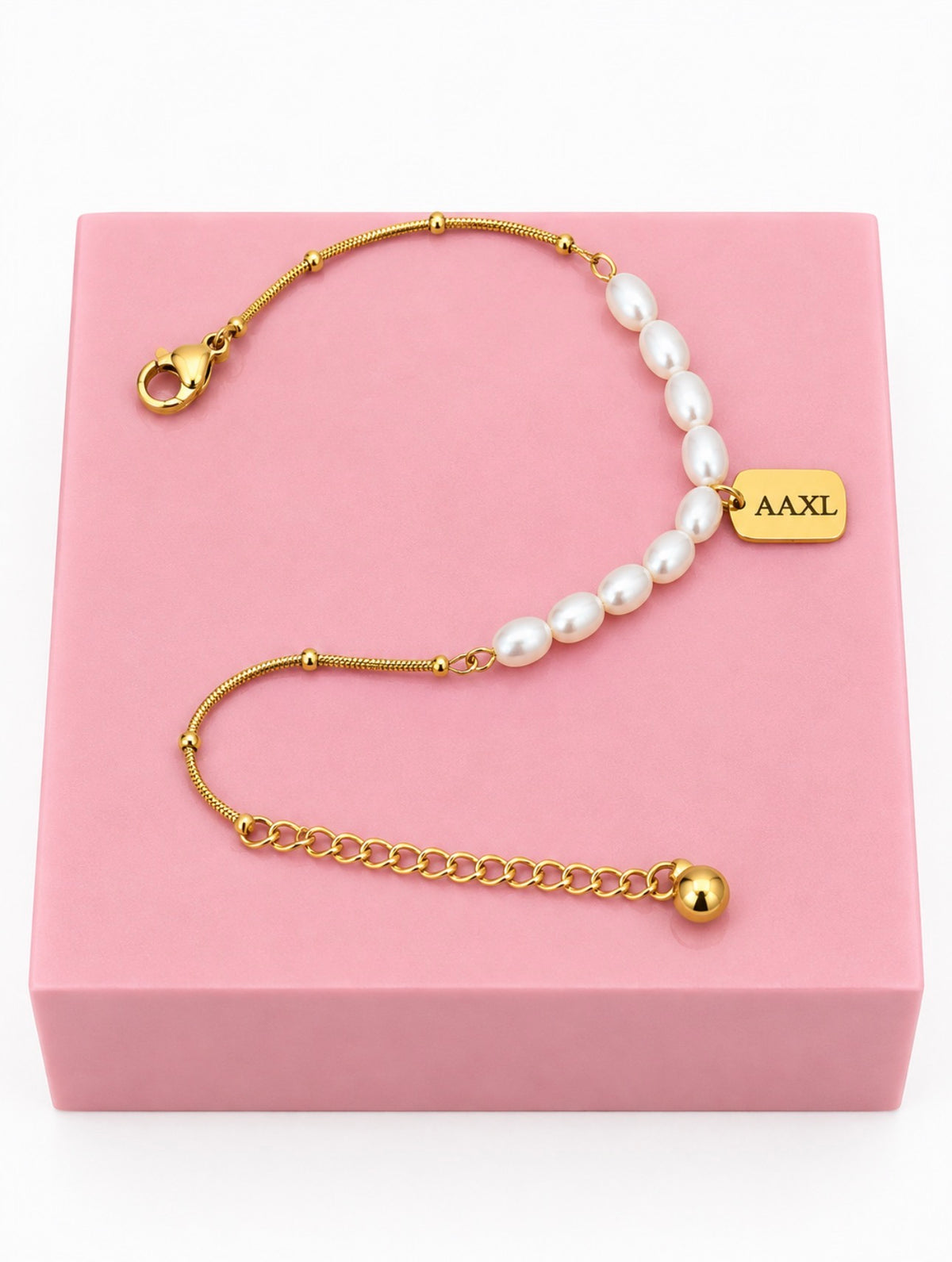 Personalized pearl charm bracelet with AAXL engraving on gold charm