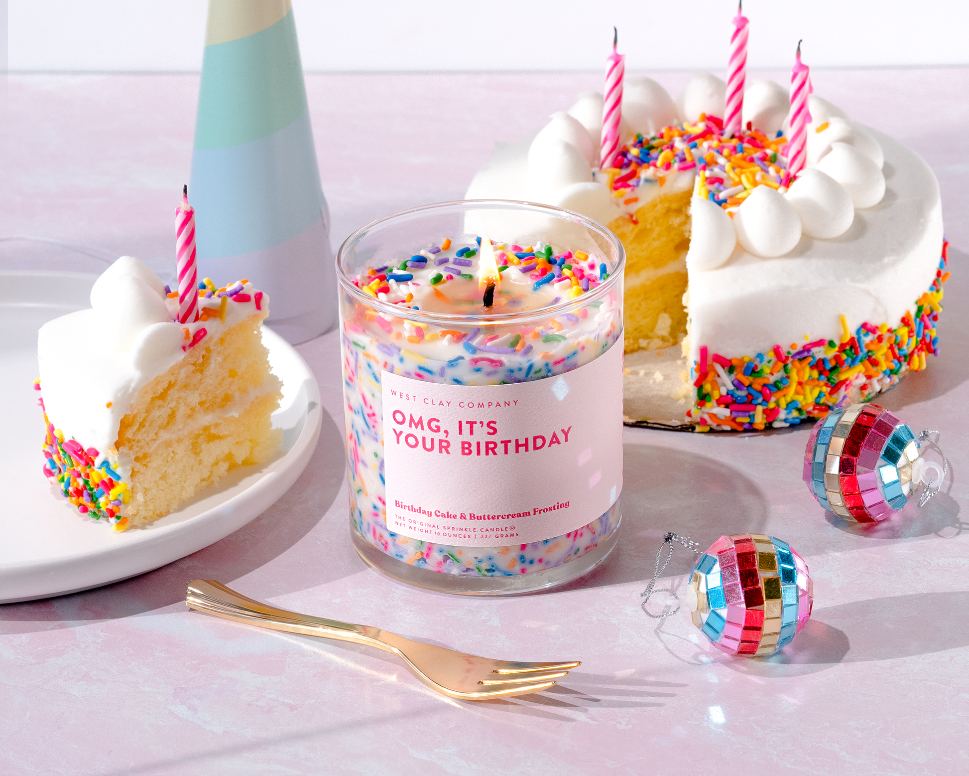 Celebrating birthday with fun colorful birthday cake scented soy candle